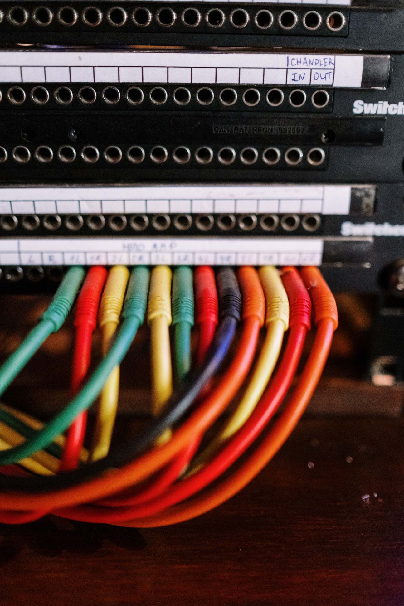 Close detail of server cables and hardware in a rack, cable wires connected to a patch panel